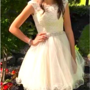 Cream colored cotillion dress. Size 2. Smoke free home.
